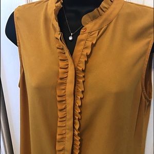 Ruffle sleeveless button down blouse